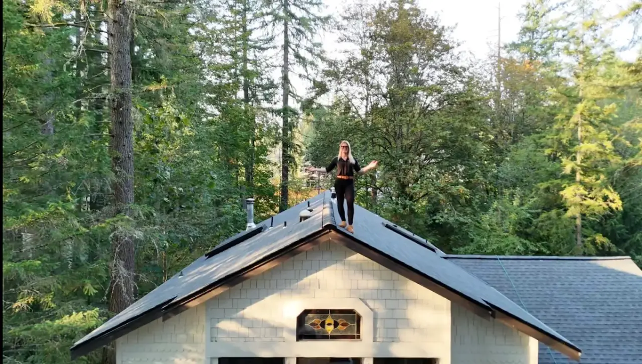 Brenda Scarllet inspecting a completed roof installation
