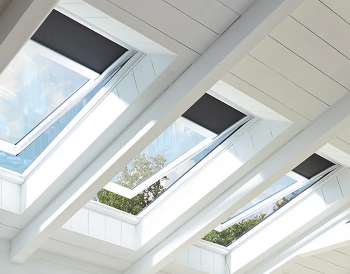 VELUX solar powered fresh air skylight installed in modern white ceiling