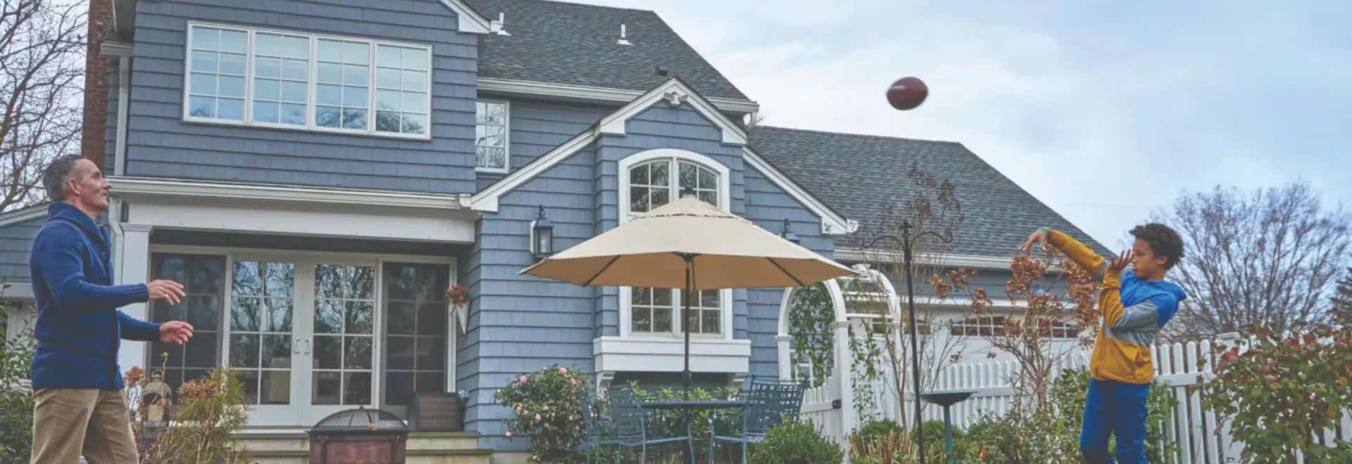 Beautiful blue-gray house with quality roof installation