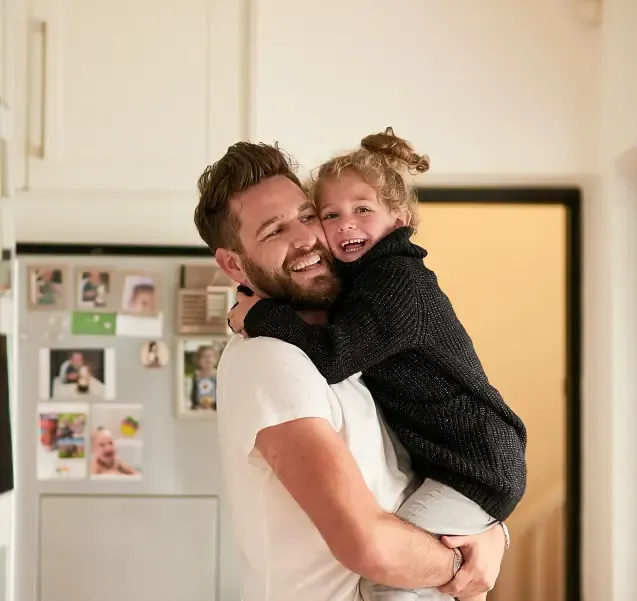 Happy father and daughter enjoying home comfort